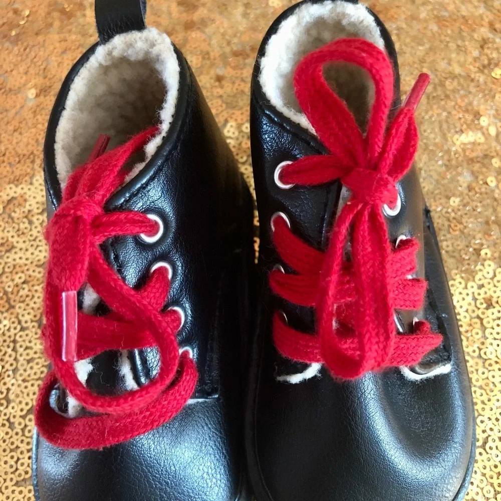 Fila-Black w/sherpa infant boots w/red laces 9-12 months old. Booties shoes